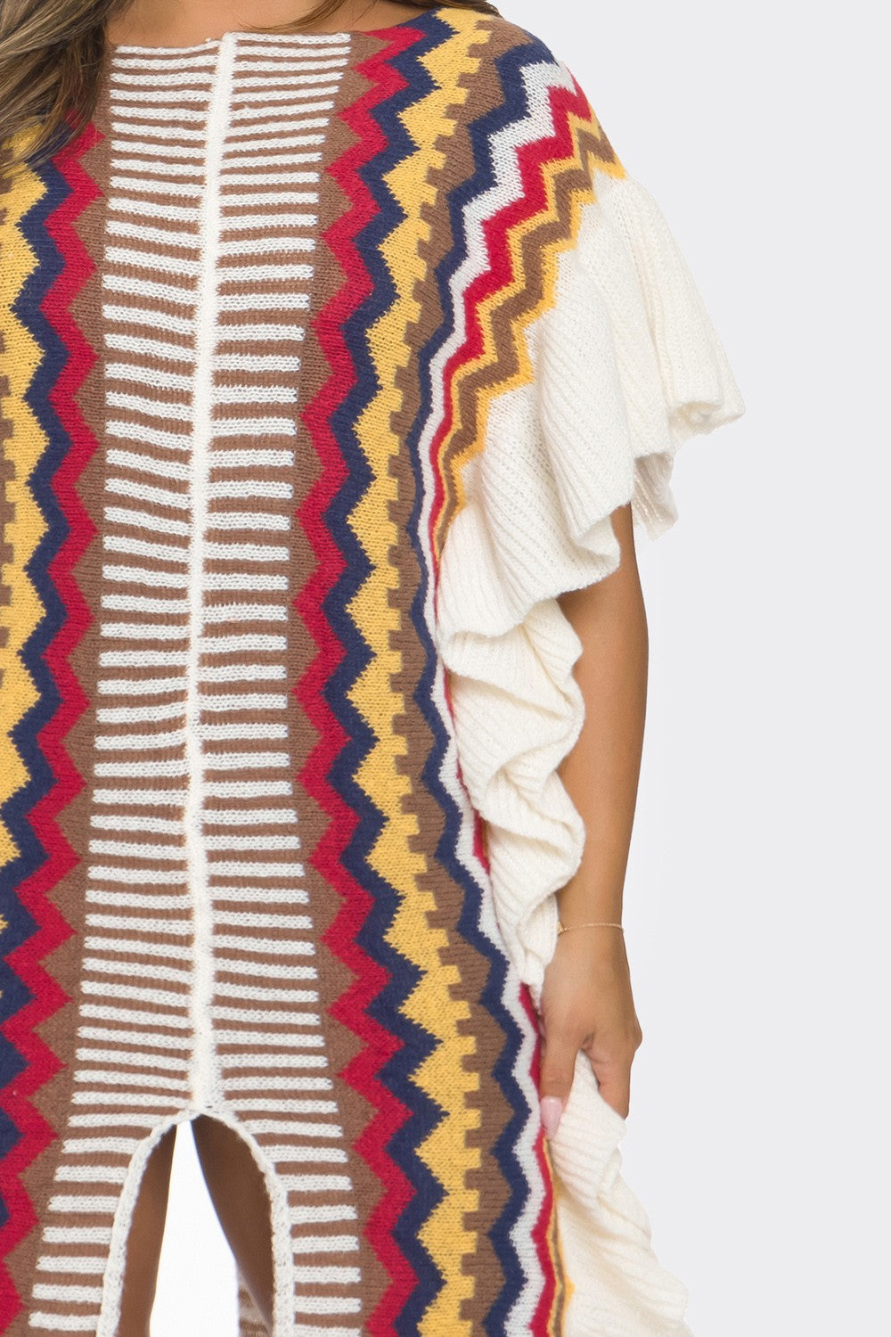 Colorful striped garment with a pattern of red, blue, and yellow on a plain background