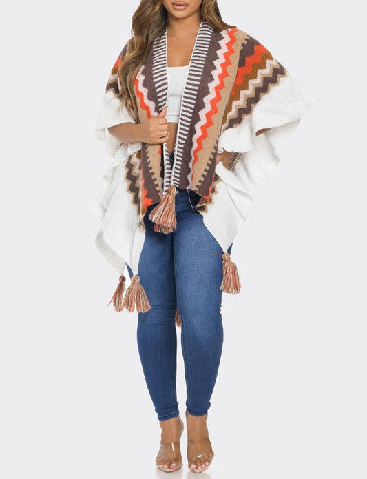 Woman wearing a patterned scarf and blue jeans on a white background
