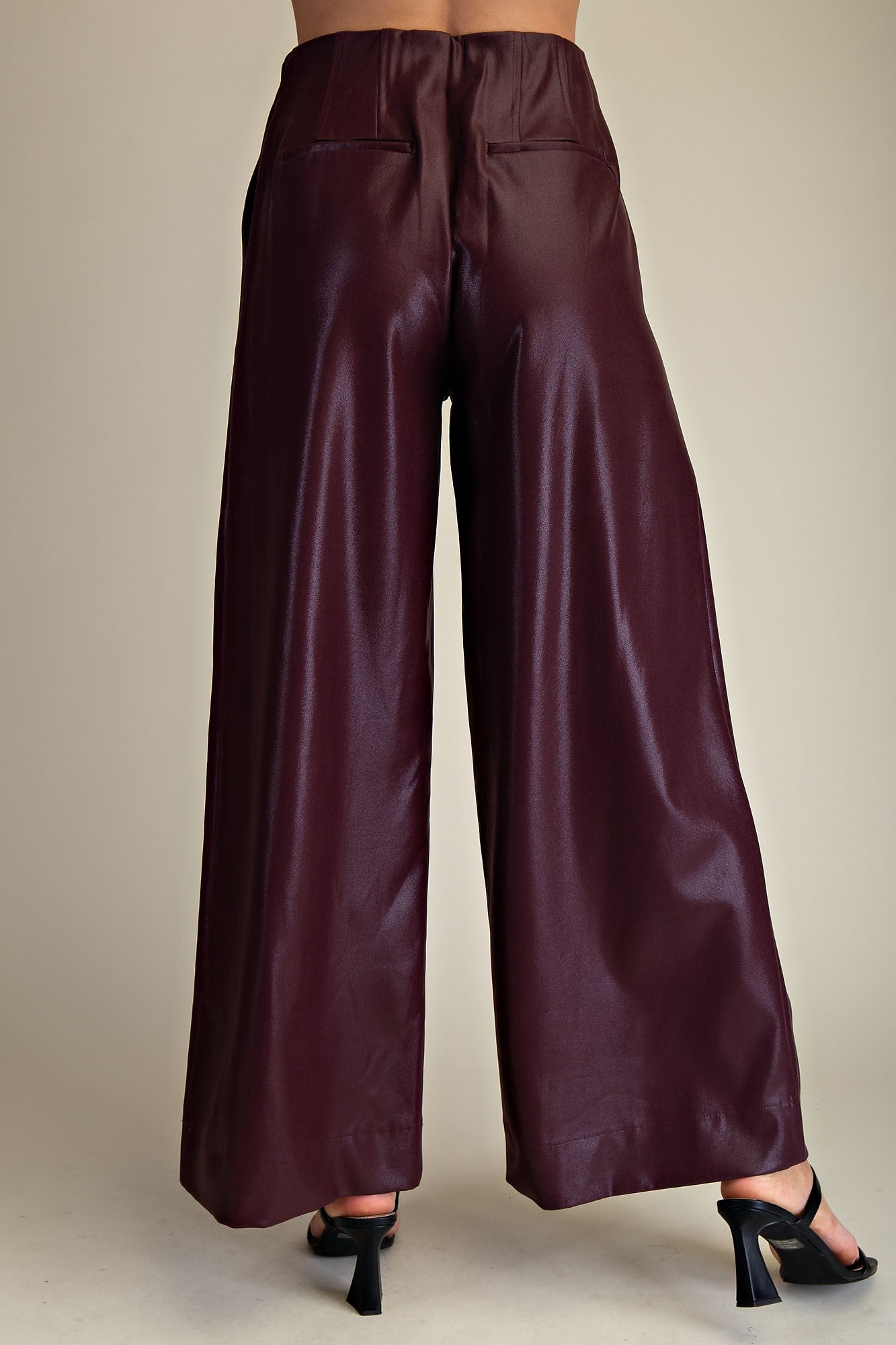 Maroon wide-leg pants on a neutral background