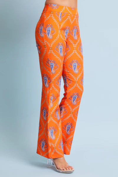 Orange pants with a pattern on a light blue background
